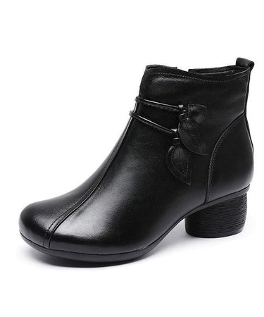 Side profile of block heel ankle boot showing leather-look upper