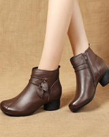 Heeled ankle boot with leaf detail on outer ankle and side zip fastening