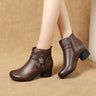 Heeled ankle boot with leaf detail on outer ankle and side zip fastening