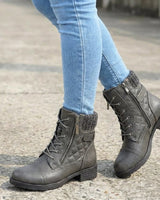 Pair of ankle boots displayed on a plain background