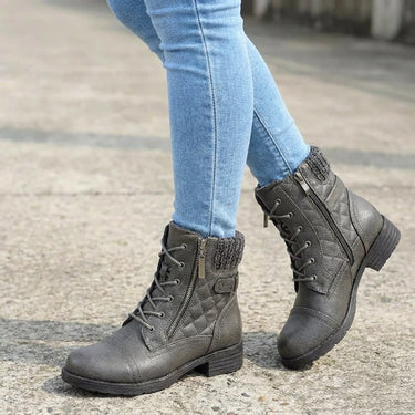 Pair of ankle boots displayed on a plain background