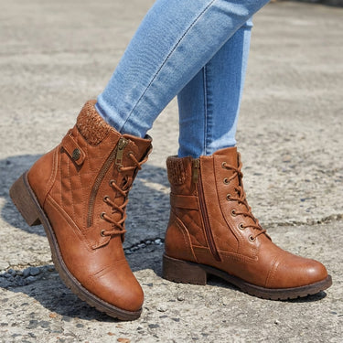 Leather ankle boots styled with straight-leg jeans