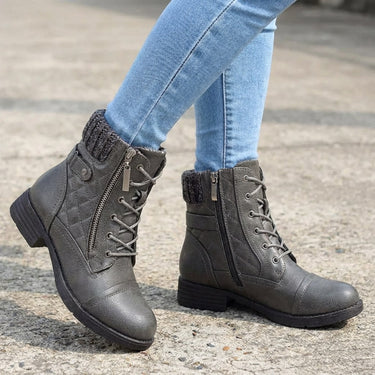 Ankle boots worn with a midi skirt, full-length view