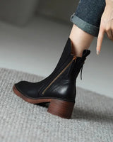 Ankle boots styled with straight-leg trousers, showing mid-shaft fit