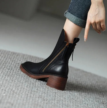 Ankle boots styled with straight-leg trousers, showing mid-shaft fit
