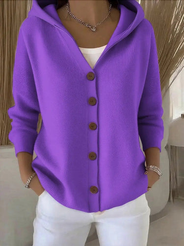 Model wearing the cardigan open over a casual outfit