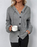 Close-up of the oversized buttons and knit texture on the cardigan front