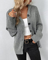 Front view of a hooded knit cardigan with large buttons down the full-length front
