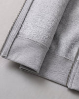 Side view of the hooded cardigan showing ribbed hem and cuffs