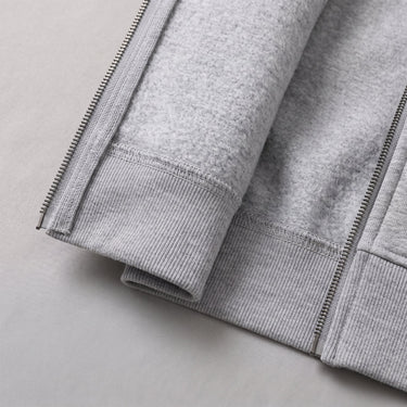 Side view of the hooded cardigan showing ribbed hem and cuffs
