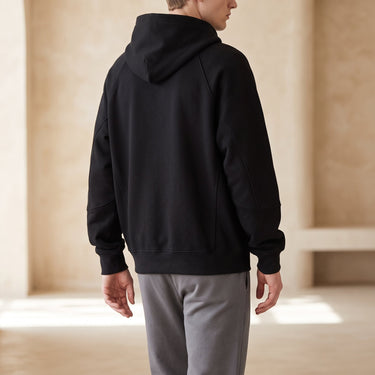 Three-quarter view of the zip up hoodie cardigan worn casually
