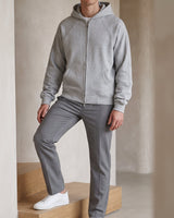 Front view of a hooded men's zip up cardigan with double zip closure