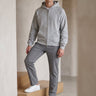 Front view of a hooded men's zip up cardigan with double zip closure