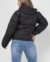 Overhead flat lay of the quilted hooded puffer jacket showing full shape