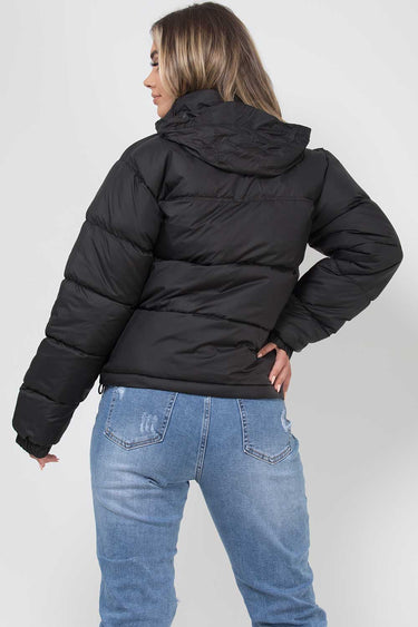 Overhead flat lay of the quilted hooded puffer jacket showing full shape