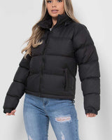 Close-up of the zip-through front fastening and drawstring hood