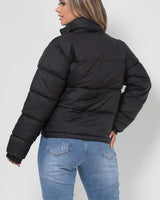 Back view of the quilted puffer jacket showing the hood and hem length