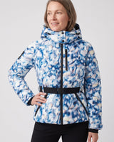 Model wearing a fitted hooded puffer jacket in a winter outdoor setting