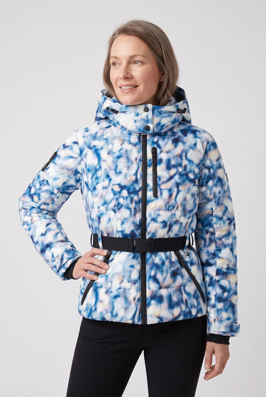 Model wearing a fitted hooded puffer jacket in a winter outdoor setting