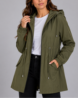 Side view showing the hip pockets and straight hem of the rain coat