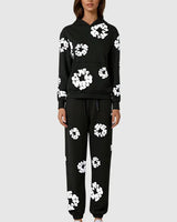 Side view of tracksuit showing hoodie pocket and trouser fit