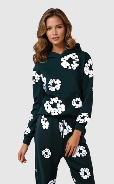 Front view of hooded tracksuit set with floral detail on model