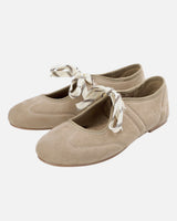 Front view of a lace-up ballet flat with cross-strap detail