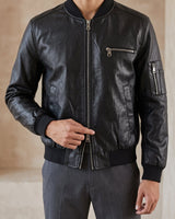 Close-up of front zip closure and collar on leather-look jacket