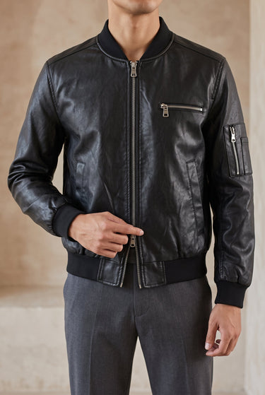 Close-up of front zip closure and collar on leather-look jacket
