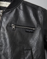 Detail of jacket body showing leather-look texture and finish