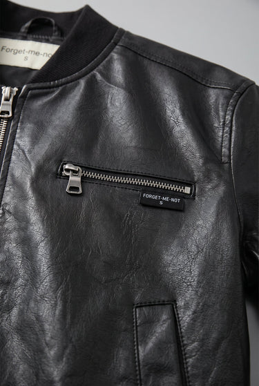 Detail of jacket body showing leather-look texture and finish