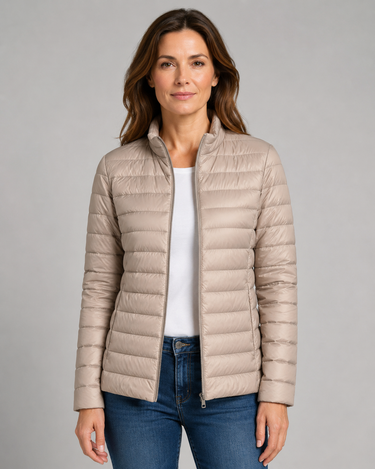 Front view of a quilted lightweight puffer jacket with stand collar and zip front
