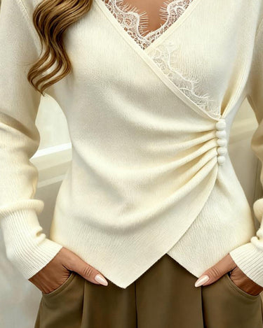 Side view showing the regular fit silhouette and long sleeve length of the lace jumper