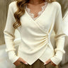 Front view of a long-sleeve lace jumper with V-neckline and ruched waist detail