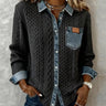 Front view of long sleeve shirt with denim patchwork panel and buckle detail