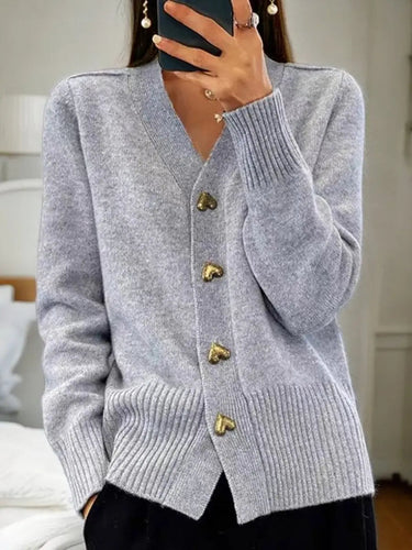 Back view of longline knit cardigan showing straight hem and long sleeves