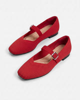 Side view of flat Mary Jane shoe with adjustable buckle ankle strap
