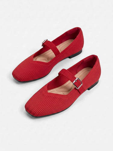Side view of flat Mary Jane shoe with adjustable buckle ankle strap