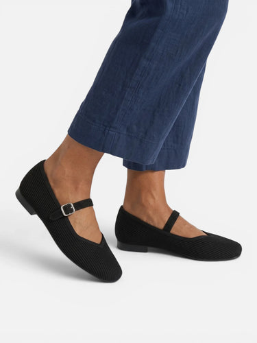Mary Jane ballet flats worn with tailored trousers, styled outfit shot