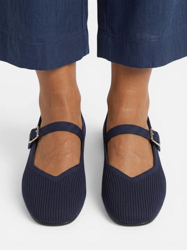 Close-up of buckle closure on ankle strap of Mary Jane flat