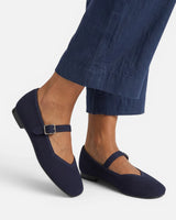 Mary Jane flats on a flat surface showing sole and profile