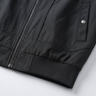 Close-up of the stand-up collar and zip fastening detail