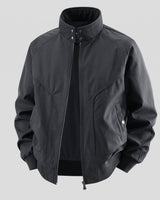 Close-up of ribbed hem and side pocket on a faux leather bomber jacket