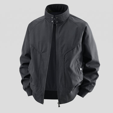 Close-up of ribbed hem and side pocket on a faux leather bomber jacket