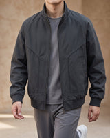 Front view of a men's faux leather bomber jacket with stand collar and zip fastening
