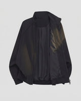 Men's bomber jacket worn in a workwear setting, three-quarter view