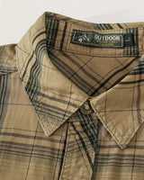 Three-quarter view of the plaid shirt showing chest pockets and button-up placket