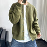 Men's knit cardigan with button front, patch pockets and ribbed cuffs, worn front-facing