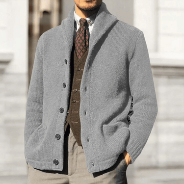 Close-up of the button placket and round neckline on a men's knit cardigan