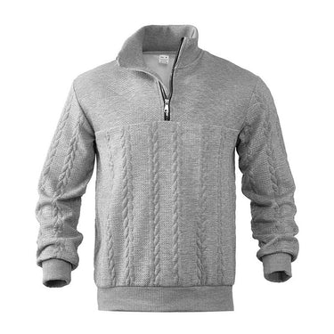 Close-up of raised diamond and cable knit texture on the jumper